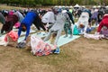 Dozens Of People Do Downward Facing Dog Yoga Pose Outdoors