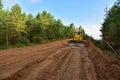 Dozer during clearing forest for construction new road . Yellow Bulldozer at forestry work Earth-moving equipment at road work, Royalty Free Stock Photo