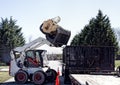 Dozer Dumping large Logs