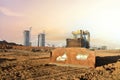 Dozer on earthmoving at construction site on sunset background. Construction machinery and equipment on groundwork. Royalty Free Stock Photo