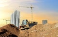 Dozer on earthmoving at construction site on sunset background. Construction machinery and equipment on groundwork. Bulldozer Royalty Free Stock Photo