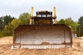 Dozer at road construction and bridge projects in forest area. Heavy machinery for road work. Building a road works. Bulldozer on