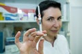 Dr. cometologist. A woman prepares a syringe with medication to correct wrinkles