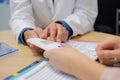 Dr and patient looking at booklet Royalty Free Stock Photo