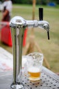 Draft beer in mug on handle tap machine Royalty Free Stock Photo