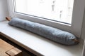 Draft Excluder Under Window Royalty Free Stock Photo