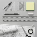 And unrolled architectural blueprints display technical drawings with Royalty Free Stock Photo