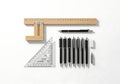 Drafting tools and pens laid out on a white surface Royalty Free Stock Photo