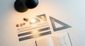 Drafting Tools Still Life: Rulers, Triangles, and Pencil Shavings on White Surface Royalty Free Stock Photo