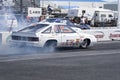 Drag car in action on the race track at the starting line