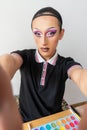 drag queen man taking a selfie in his transformation process and makeup Royalty Free Stock Photo