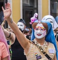 A drag queen with a pink flamingo on the head attending the Gay Pride parade also known as Christopher Street Day CSD in Munich