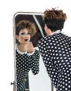 Drag Queen use Lipstick near Mirror