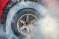 Drag racing car burns its tires in preparation for the race Royalty Free Stock Photo