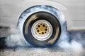 Drag racing car burns tires for the race Royalty Free Stock Photo