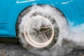 Drag racing car burns rubber off its tires in preparation for the race Royalty Free Stock Photo