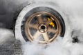 Drag racing car burns tire in preparation for the race Royalty Free Stock Photo