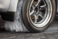 Drag racing car burns tires for the race Royalty Free Stock Photo