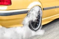 Drag racing car burns tires at start line. Royalty Free Stock Photo