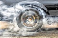 Drag racing car burns tires at start line. Royalty Free Stock Photo