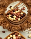 Dragee, confetto or sugared almond on the mirror Royalty Free Stock Photo