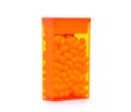 Dragee in orange container Royalty Free Stock Photo