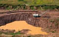 Dragline excavator works in an open pit for the extraction of clay. Largest Walking Dragline Excavator in the clay quarry. Big Royalty Free Stock Photo