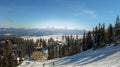 Dragobrat, Ukraine -  February 21, 2017:Winter ski resort. View from the mountain to the village in the forest. Skiers and Royalty Free Stock Photo