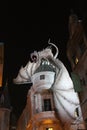 Dragon atop building at night