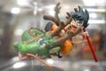 Dragon Ball Z. A photo of Son Gohan kid is riding on a dragon is displayed on shelf. Gohan is a protagonist from Dragon Ball Z,.