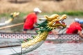 Dragon boat`s head with the race at the background Royalty Free Stock Photo