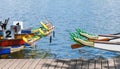 Dragon boats moored at wooden jetty Royalty Free Stock Photo