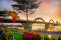 Dragon bridge on a beautiful sunset with many flowers Royalty Free Stock Photo