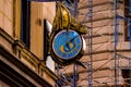 Dragon Clock on facade of building.