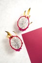 Dragon fruit half on birght pink background