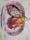 Dragon fruit on the plate ,pink fruit with nice taste Royalty Free Stock Photo