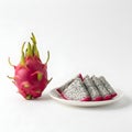 Dragon Fruit Whole and Sliced on White Plate Royalty Free Stock Photo