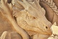 Dragon head as a sculpture in the sand Royalty Free Stock Photo