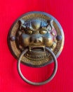 Dragon head door handle on the red door in a buddhist temple in the Sanya Nanshan Cultural Center Royalty Free Stock Photo