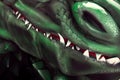 Dragon jaws with shark white teeth and bloody mouth closeup image. Huge nostril and green reptile skin macro. Fantastic magic