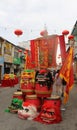 With dragon masks stacked to a tower Chinese celebrating their Chinese New Year