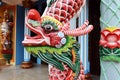 Dragon on one of the columns at the entrance door of the Cao Dai Taoist temple Hoi An, Vietnam