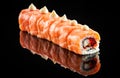 Dragon roll with salmon over black Royalty Free Stock Photo