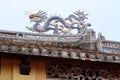Dragon on the roof of the temple in the backyard of the Van Mieu Confucius Temple. Hoi An, Vietnam