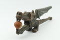 A dragon-shaped nutcracker with a hazelnut in its mouth Royalty Free Stock Photo