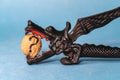 dragon shaped nutcracker with a nut in its teeth Royalty Free Stock Photo
