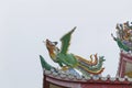 Dragon statue on roof with sky background. Royalty Free Stock Photo