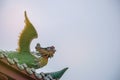 Dragon statue on roof with sky background. Royalty Free Stock Photo