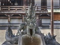 A dragon supplying water at purification fountain.