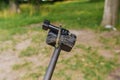 Dragonfly sits on tripod action camera in nature. Shooting nature action camera. Interesting insects